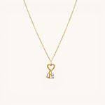 Nadare Co. 14k gold plated necklace featuring a gothic initial charm and a sparkling rectangular birthstone pendant.