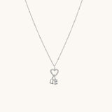 Nadare Co. silver gothic initial and birthstone necklace featuring a heart charm on a delicate beaded chain