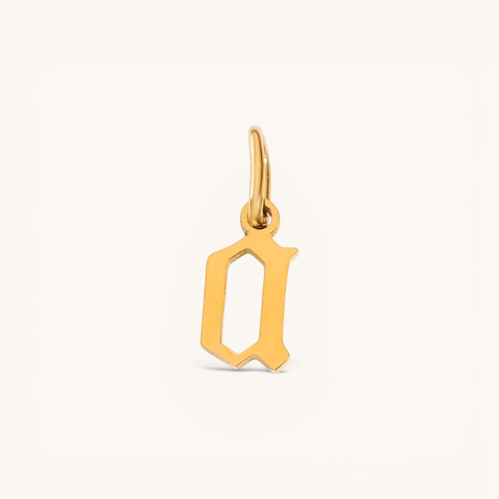 Nadare Co. gothic letter D charm in 14k gold plated stainless steel with sharp old-English typography.