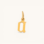 Nadare Co. gothic letter D charm in 14k gold plated stainless steel with sharp old-English typography.