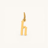 Nadare Co. gothic letter h charm in 14k gold plated stainless steel with sharp old-English typography
