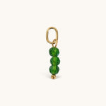 Nadare Co. birth month bead charm featuring three faceted green beads on a gold jump ring for necklace stacking.