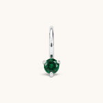Nadare Co. mini birthstone charm featuring a round green cubic zirconia stone in a silver-tone setting