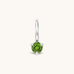 Nadare Co. mini birthstone charm featuring a round green cubic zirconia stone set in polished silver-tone metal.