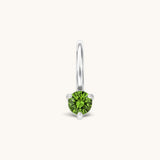 Nadare Co. mini birthstone charm featuring a round green cubic zirconia stone set in polished silver-tone metal.