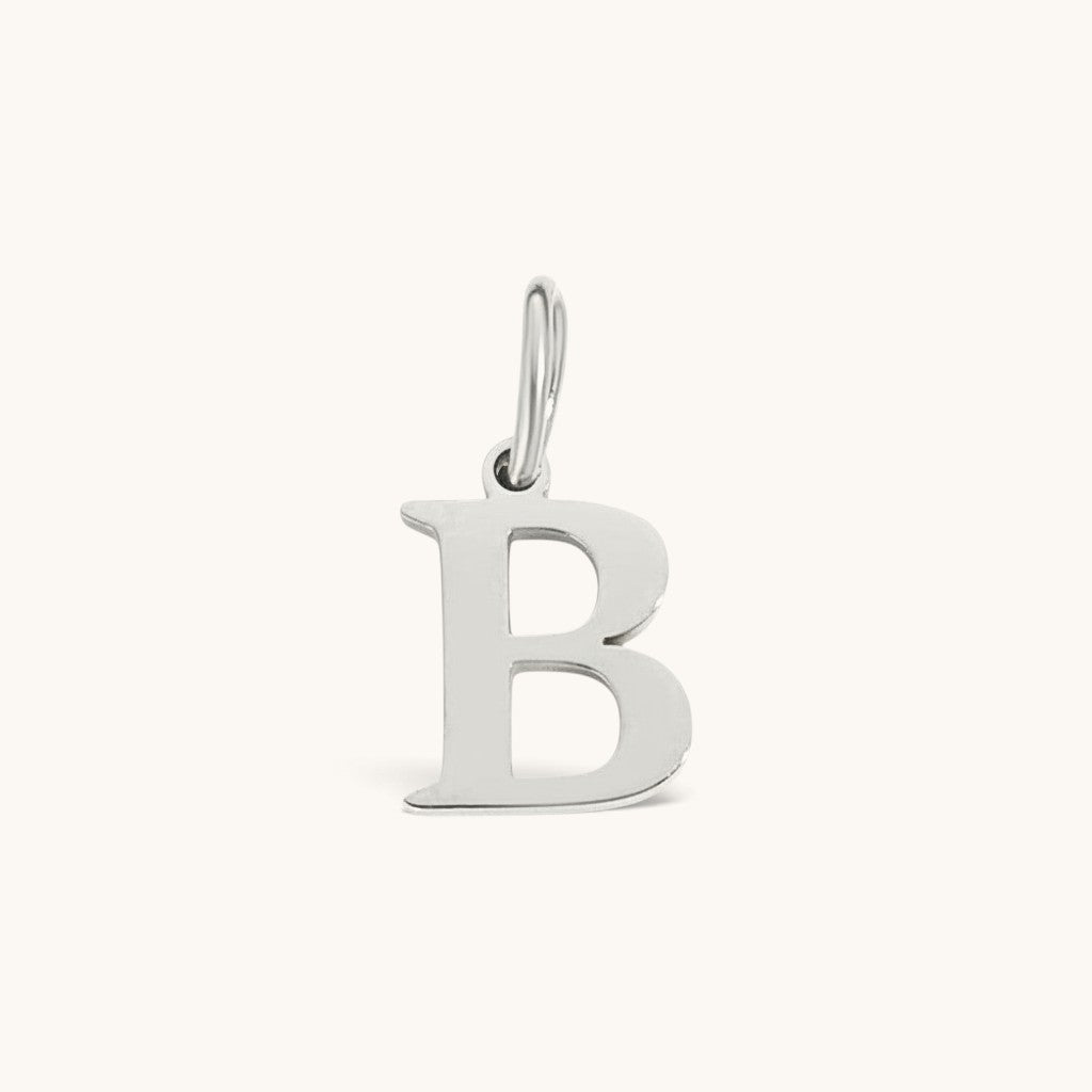 Nadare Co. silver-toned stainless steel initial B charm with a classic serif font for everyday layering.