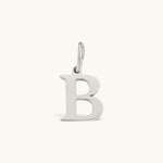 Nadare Co. silver-toned stainless steel initial B charm with a classic serif font for everyday layering.