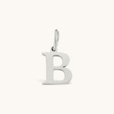 Nadare Co. silver-toned stainless steel initial B charm with a classic serif font for everyday layering.
