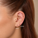 Nadare Co. Iris Threadless Front gold titanium bead piercing jewelry worn in a curated ear stack