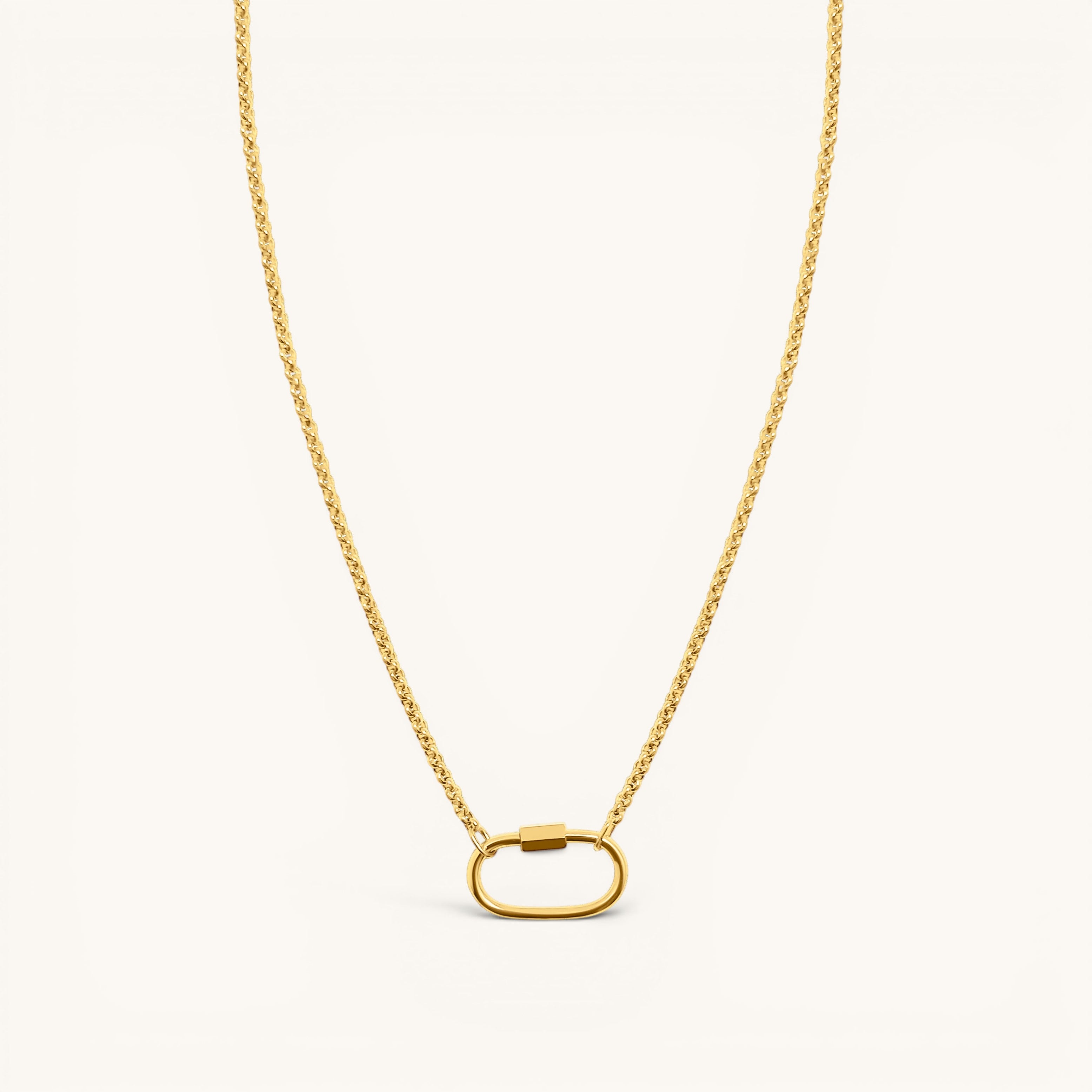 Nadare Co. gold chain necklace featuring a large oval carabiner clasp for holding charms.
