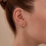Nadare Co. Laurel threadless earring featuring marquise and round cubic zirconia stones worn in a lobe piercing.
