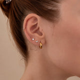 Nadare Co. Laurel threadless earring featuring marquise and round cubic zirconia stones worn in a lobe piercing.