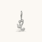 Nadare Co. silver-tone Leo zodiac charm with sparkling cubic zirconia accents for necklace layering.
