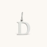 Nadare Co. silver-toned letter D initial charm with a clean serif font, crafted for everyday necklace layering.