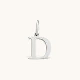 Nadare Co. silver-toned letter D initial charm with a clean serif font, crafted for everyday necklace layering.