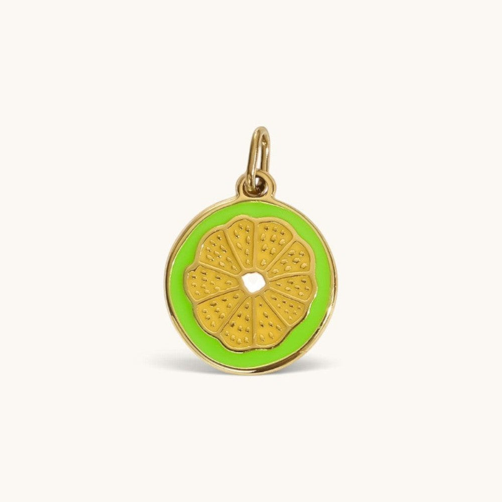 Nadare Co. Lime Slice Charm featuring vibrant green enamel and polished gold detailing in a citrus fruit design.