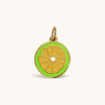 Nadare Co. Lime Slice Charm featuring vibrant green enamel and polished gold detailing in a citrus fruit design.