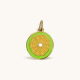 Nadare Co. Lime Slice Charm featuring vibrant green enamel and polished gold detailing in a citrus fruit design.