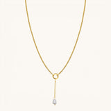 Nadare Co. long pearl drop charm on a gold chain necklace featuring a 3cm delicate chain and freshwater pearl.