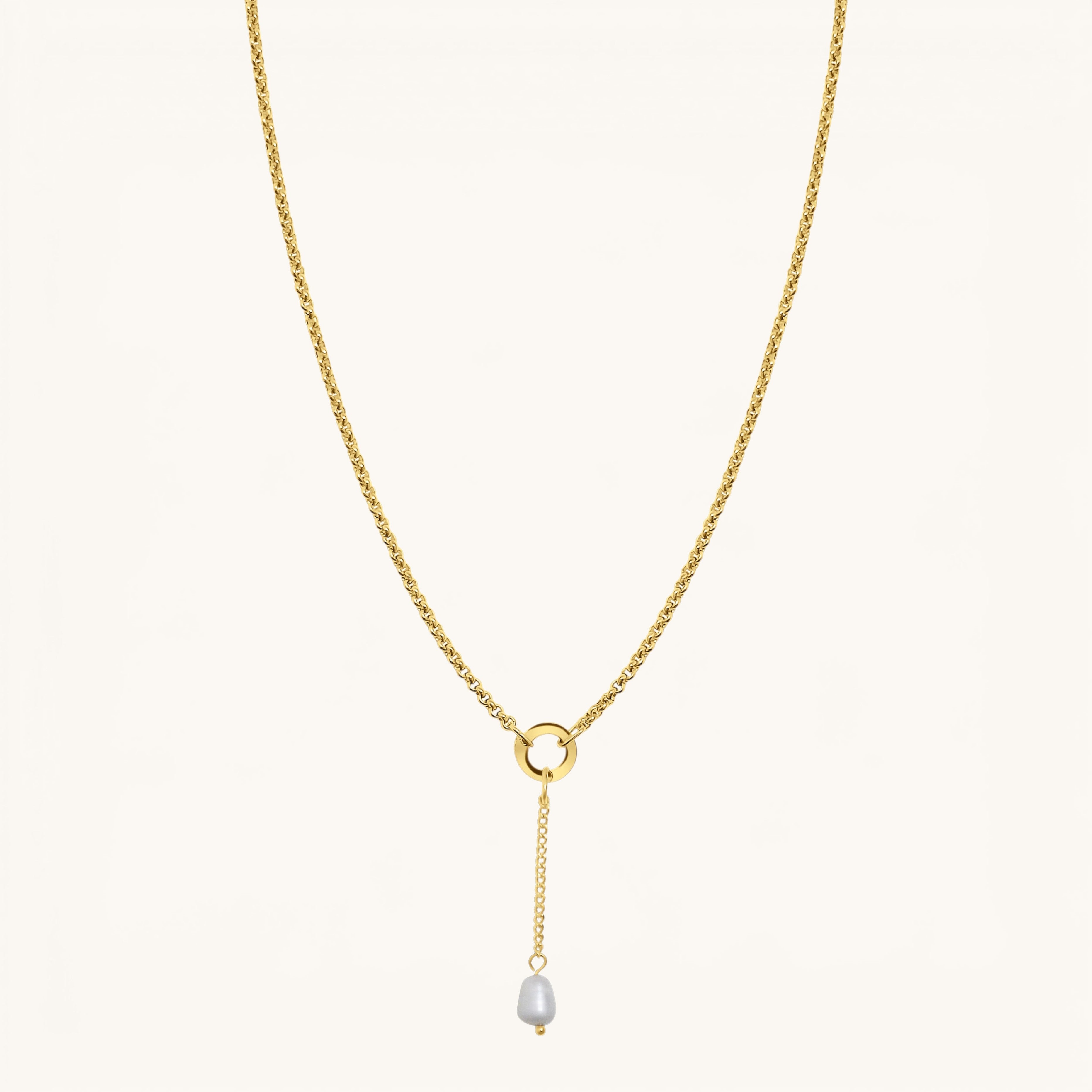 Nadare Co. long pearl drop charm on a gold chain necklace featuring a 3cm delicate chain and freshwater pearl.