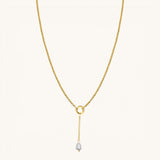 Nadare Co. long pearl drop charm on a gold chain necklace featuring a genuine freshwater pearl and 14k gold plating.
