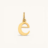 Nadare Co. lowercase letter e charm in 14k gold-plated stainless steel for everyday jewelry layering.