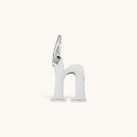 Nadare Co. silver-toned lowercase letter h charm made of stainless steel for everyday jewelry layering.