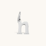 Nadare Co. silver-toned lowercase letter h charm made of stainless steel for everyday jewelry layering.