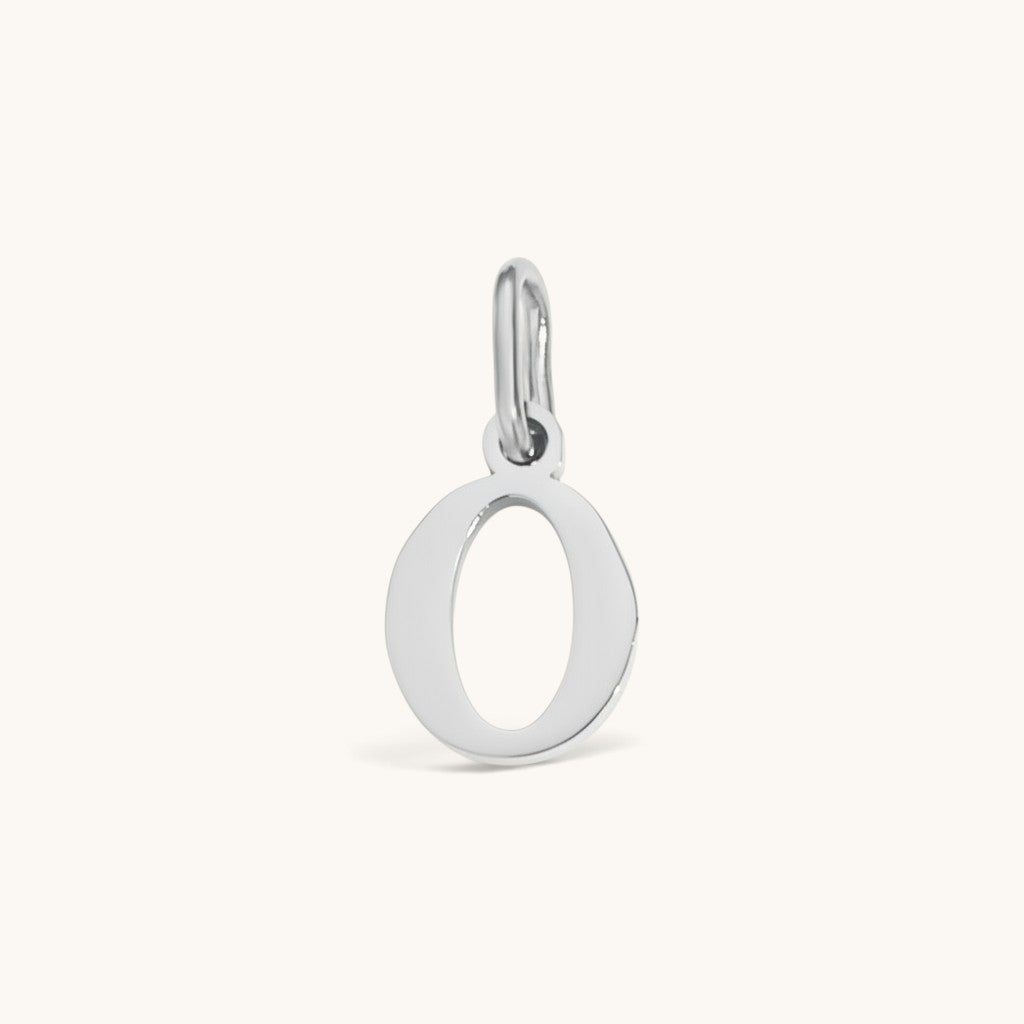 Nadare Co. silver-tone lowercase letter O charm made of durable stainless steel for everyday jewelry layering.