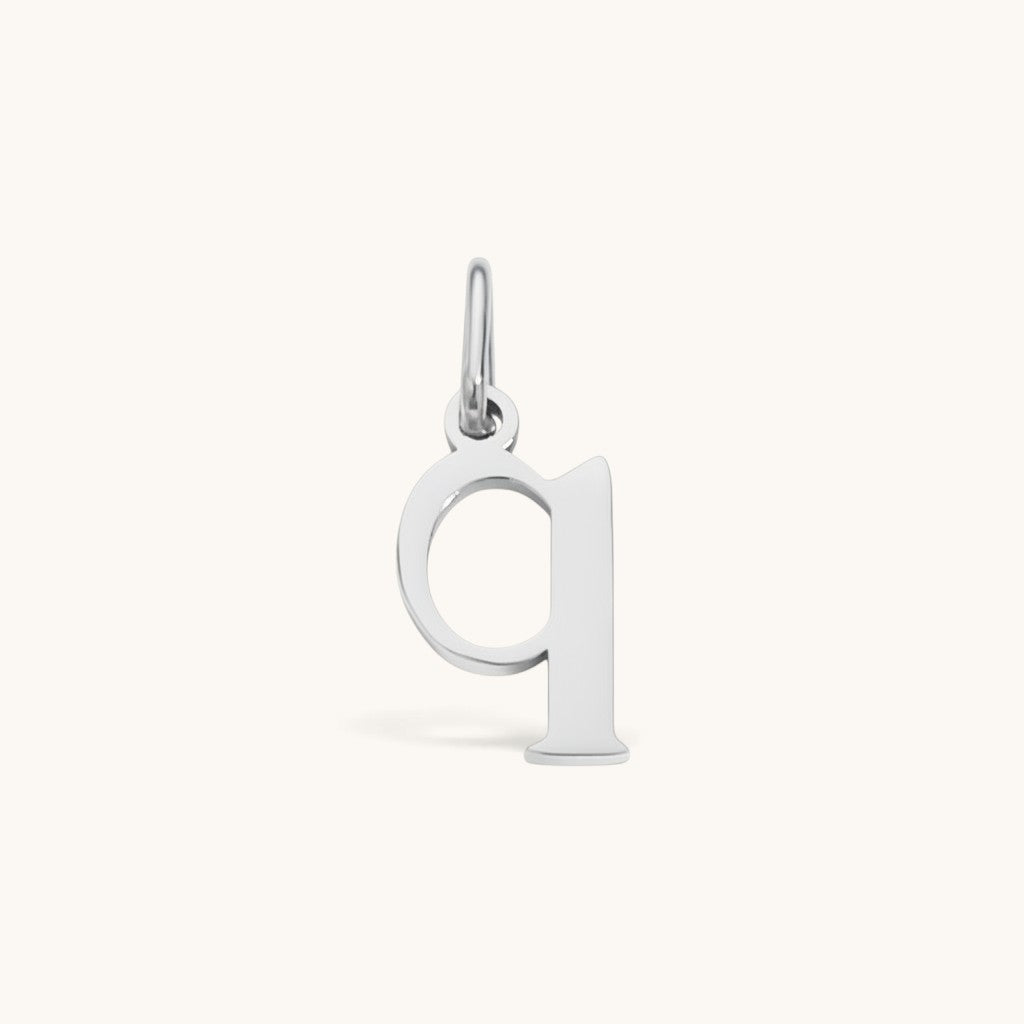Nadare Co. silver-toned lowercase letter q initial charm made of durable stainless steel for everyday jewelry layering