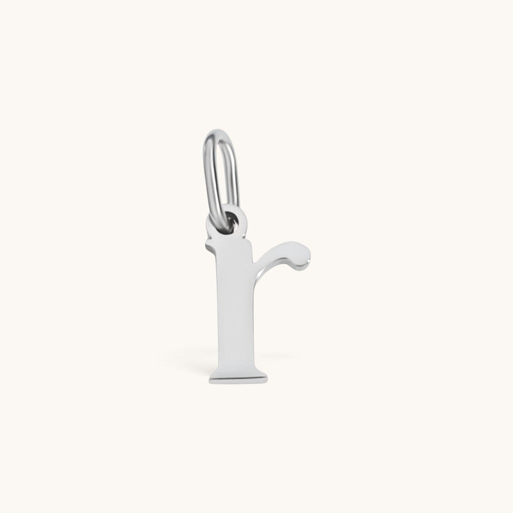 Nadare Co. silver-toned lowercase letter r charm made of stainless steel with a minimalist design for everyday wear