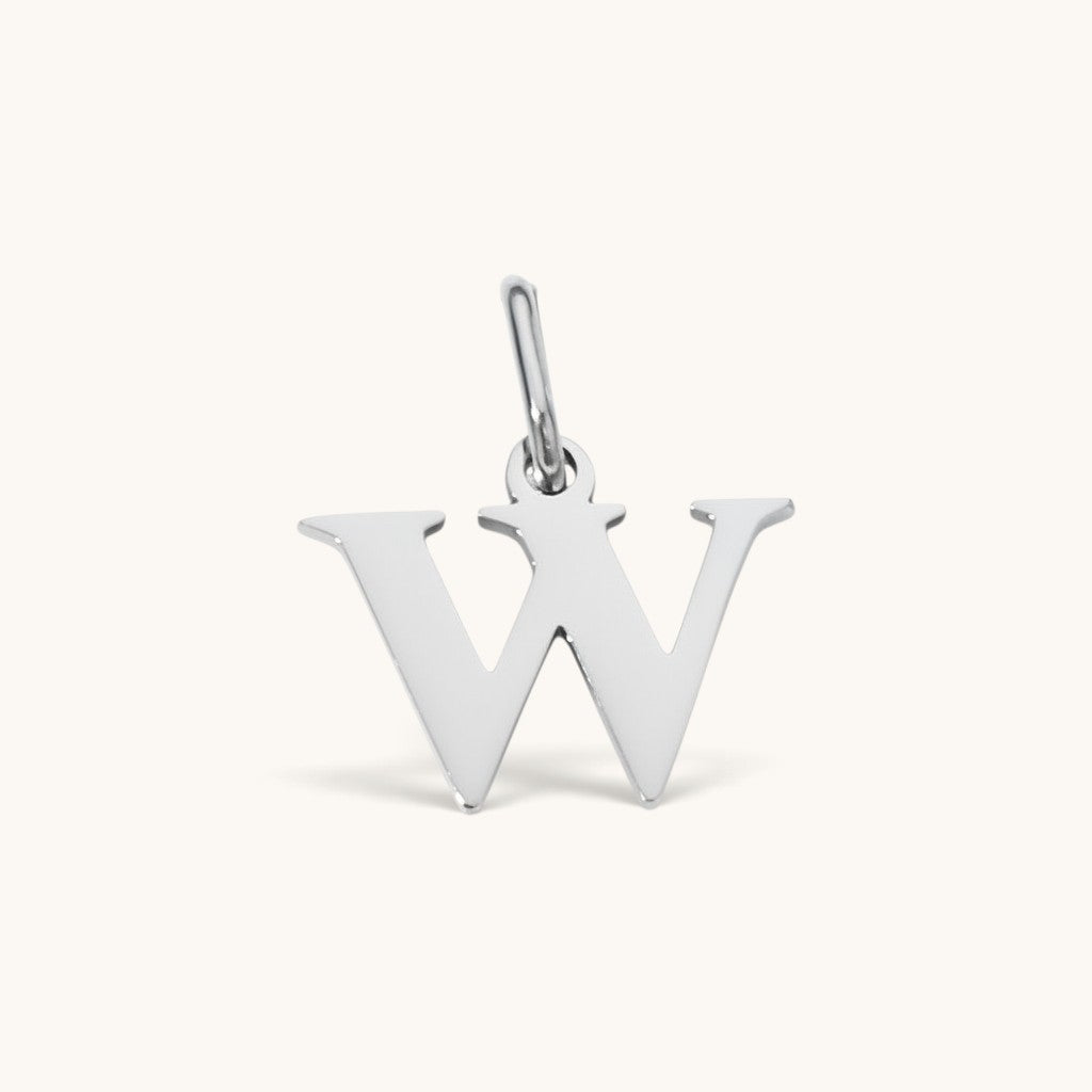Nadare Co. silver-toned lowercase letter W charm made of stainless steel for everyday jewelry layering.