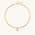 Nadare Co. Margot gold collar necklace featuring a sleek polished chain and a single pear-shaped bezel-set crystal.