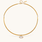 Nadare Co. Margot gold collar necklace with a sleek chain and a single marquise-cut bezel-set crystal pendant.