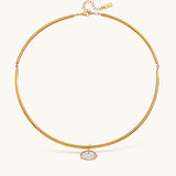 Nadare Co. Margot gold collar necklace with a sleek chain and a single marquise-cut bezel-set crystal pendant.