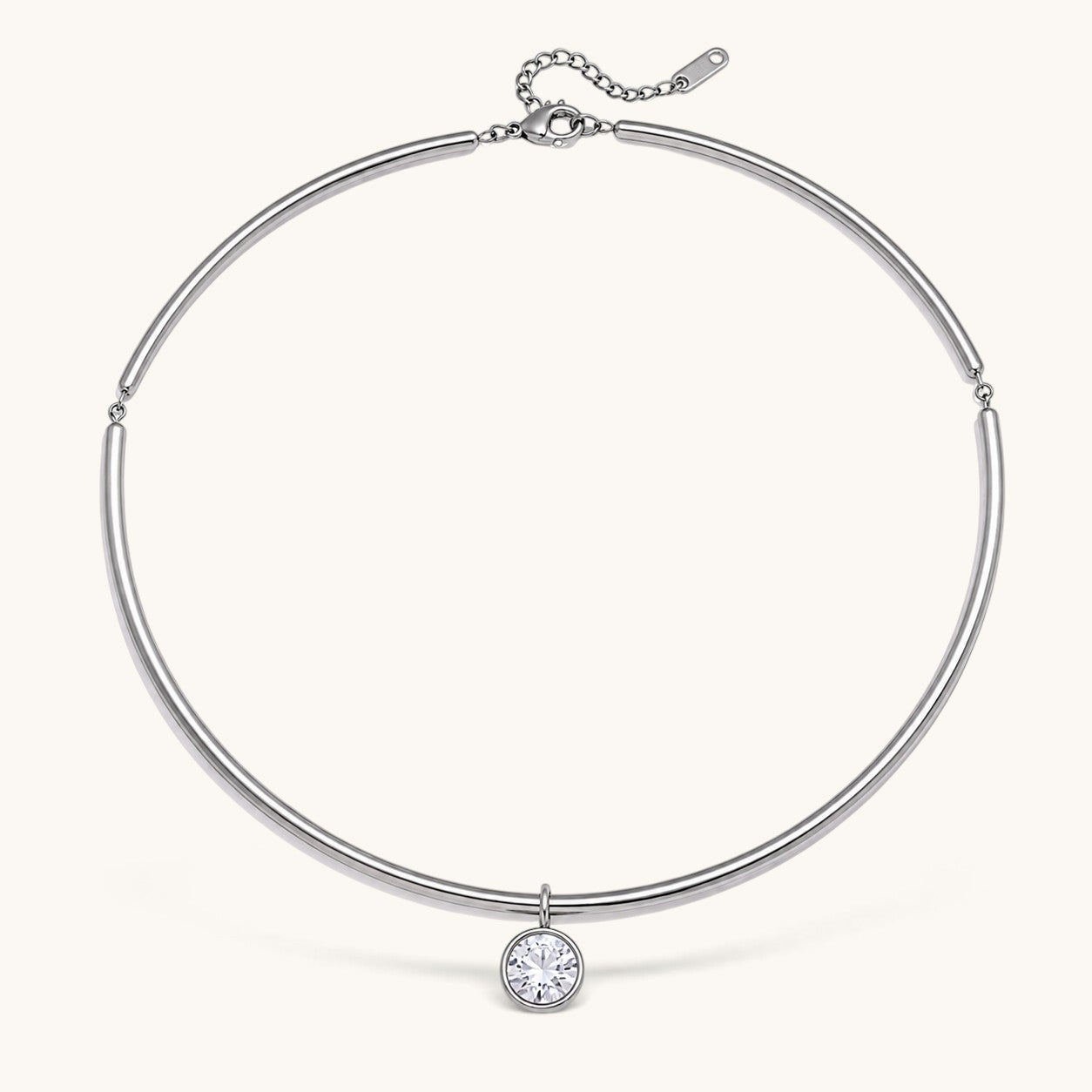 Nadare Co. Margot silver collar necklace with a polished chain and a single sparkling bezel-set round crystal pendant.