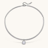 Nadare Co. Margot silver collar necklace with a polished chain and a single sparkling bezel-set round crystal pendant.
