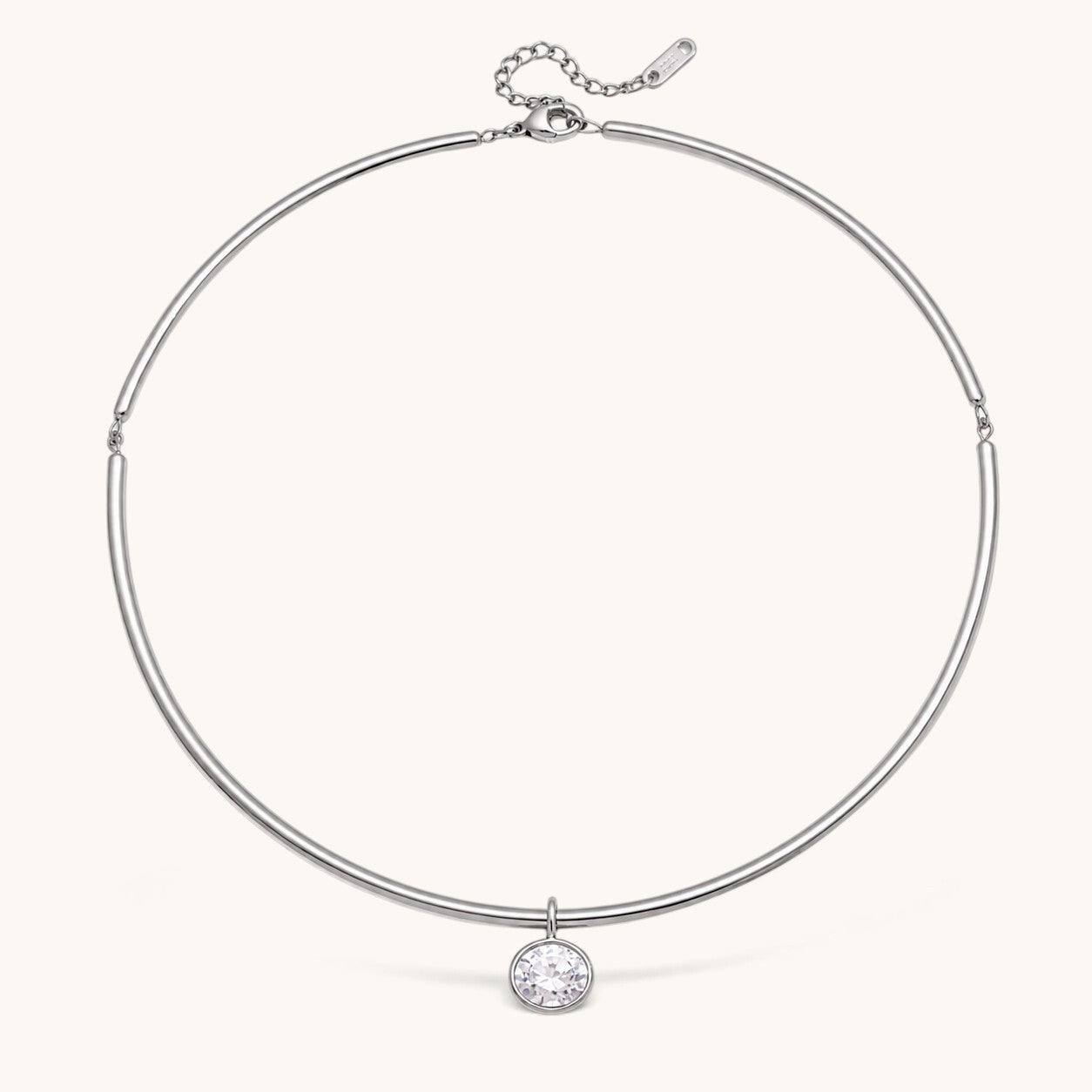 Nadare Co. Margot silver collar necklace with a polished chain and a single sparkling bezel-set round crystal pendant.