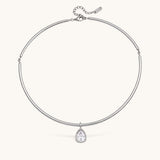 Nadare Co. Margot silver collar necklace with a pear-shaped bezel-set crystal pendant on a polished chain