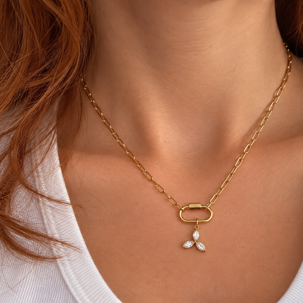 Nadare Co. Marquise Trio Charm featuring three marquise-cut cubic zirconia stones on a gold-plated chain necklace.