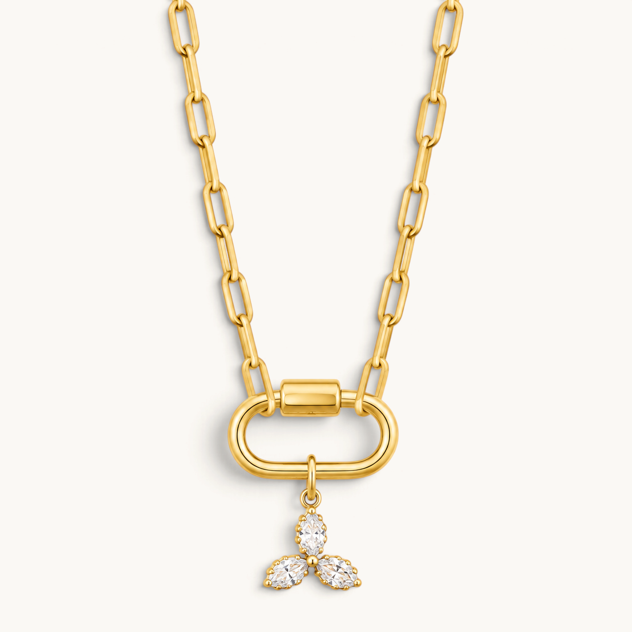 Nadare Co. Marquise Trio Charm featuring three marquise-cut cubic zirconia stones on a gold-plated link chain.