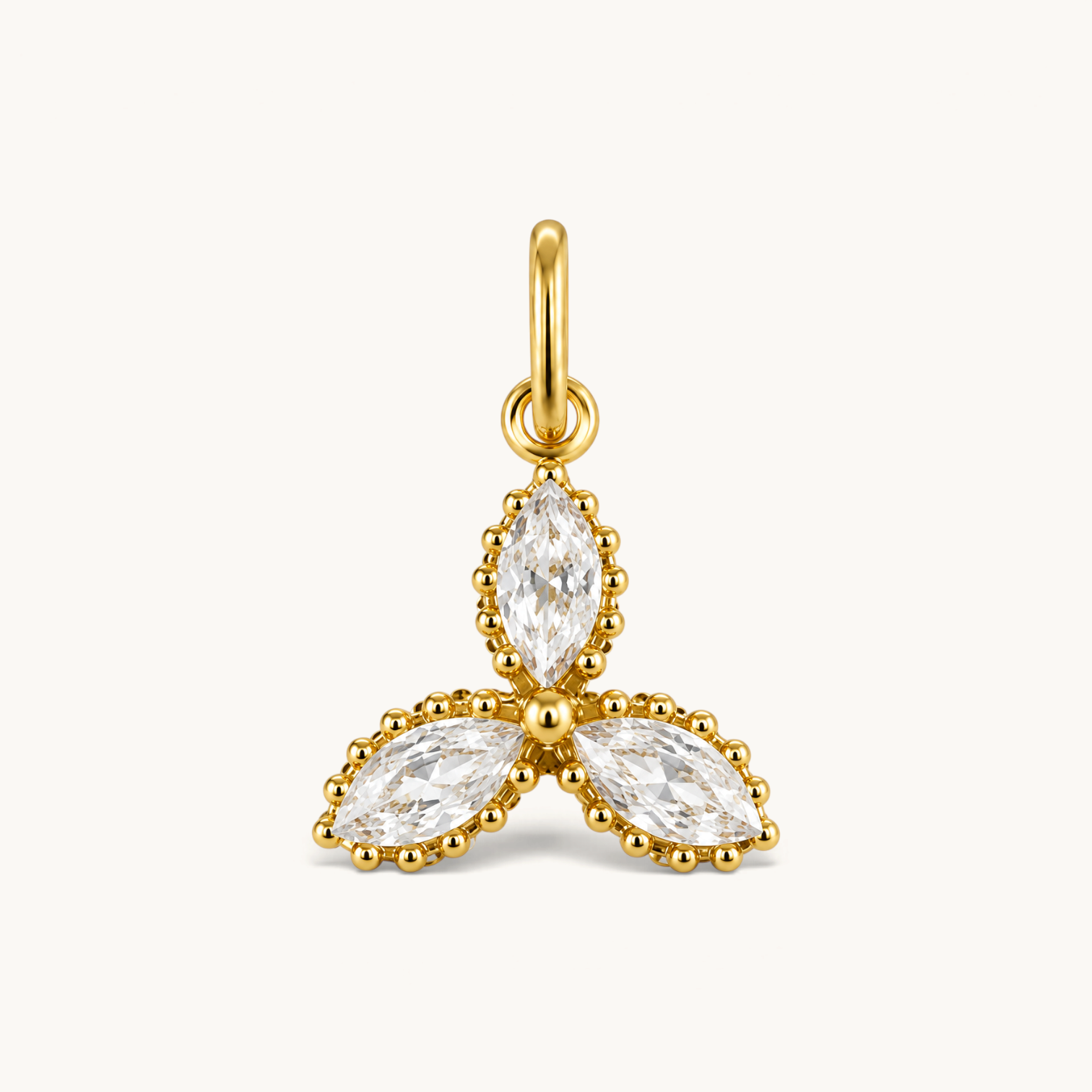 Nadare Co. Marquise Trio Charm featuring three marquise-cut cubic zirconia stones in 14k gold-plated stainless steel.