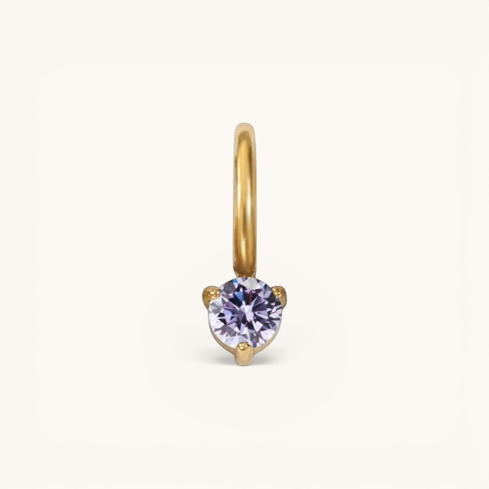 Nadare Co. mini birthstone charm featuring a round lavender gemstone set in polished gold on a small hoop.