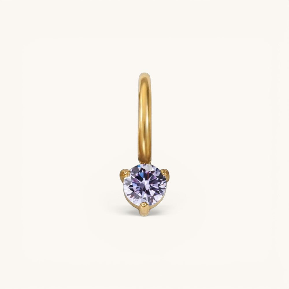Nadare Co. mini birthstone charm featuring a round lavender gemstone set in polished gold on a small hoop.