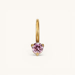 Nadare Co. mini birthstone charm featuring a round pink gemstone set in polished gold on a small hoop.