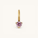 Nadare Co. mini birthstone charm featuring a round pink gemstone set in polished gold on a small hoop.