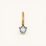 Nadare Co. mini birthstone charm featuring a round brilliant-cut white gemstone set in polished yellow gold.