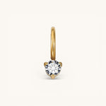 Nadare Co. mini birthstone charm featuring a round brilliant-cut white gemstone set in polished yellow gold.