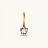 Nadare Co. mini birthstone charm featuring a round brilliant-cut white gemstone set in polished yellow gold.