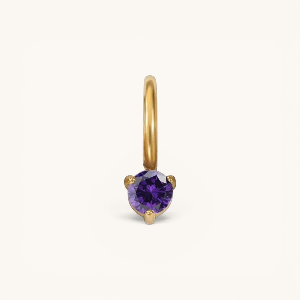 Nadare Co. mini gold hoop charm featuring a round-cut purple amethyst birthstone in a three-prong setting.